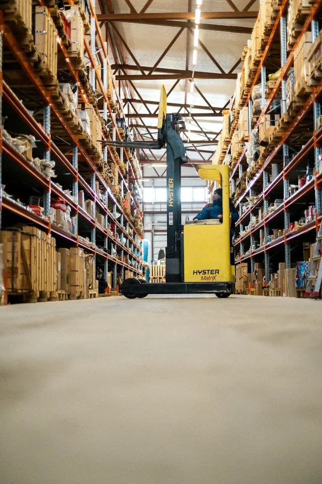 Forklift in a high-bay materials warehouse